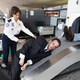 A TSA officer loads in the tall stock for a routine explosives scan.